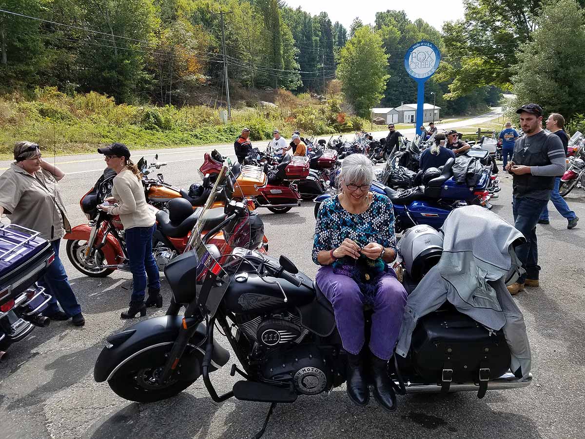 Knitting while we wait for the "kickstands up!" call at the Foxcreek Customer Appreciation Ride.