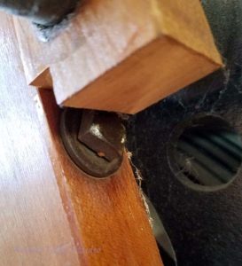 Square headed bolt under the warp reel support.
