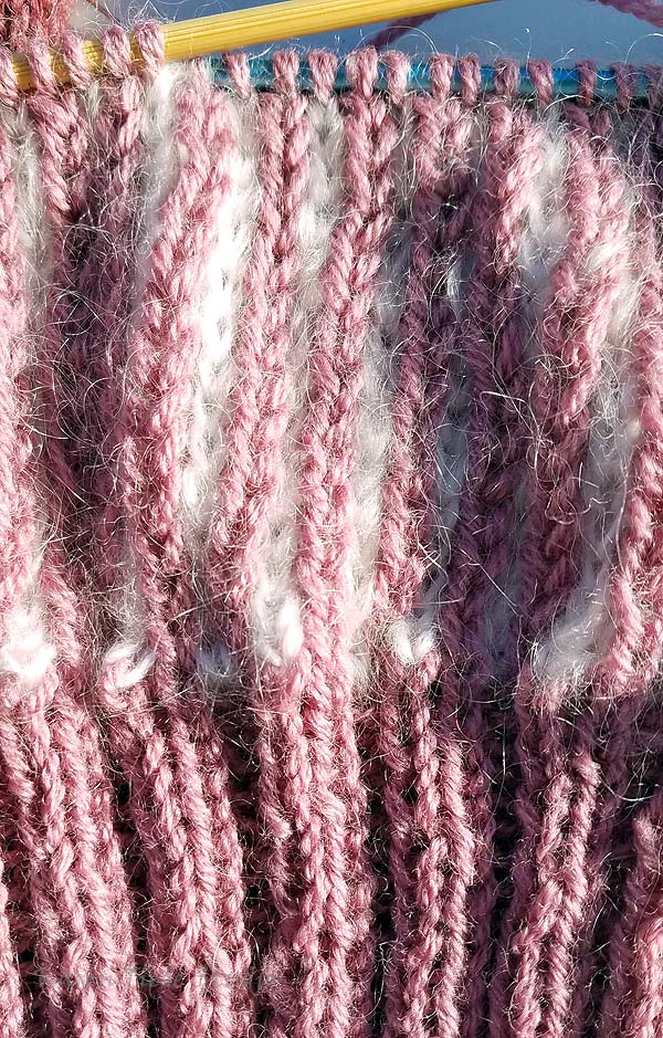 Solid color ribbing with K1B stripes above.