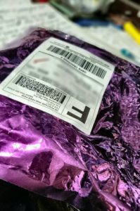 Purple mylar shipping bag from Black Trillium Fibers.