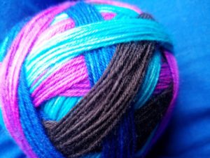 Self-striping sock yarn from Super Stitchy, colorway Crabulous.
