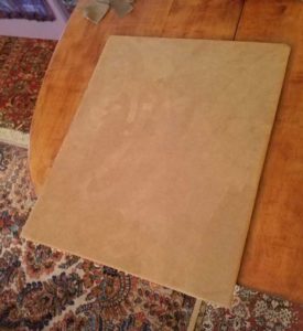 Front of the backing board covered with fabric.