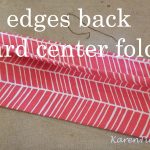 Fold the edges back to the center fold line.