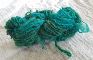 The dyed roving, spun and plied in the wrong direction.