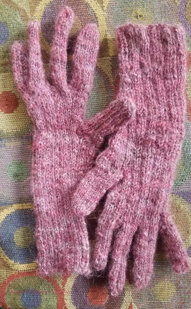 Handknit gloves before blocking.