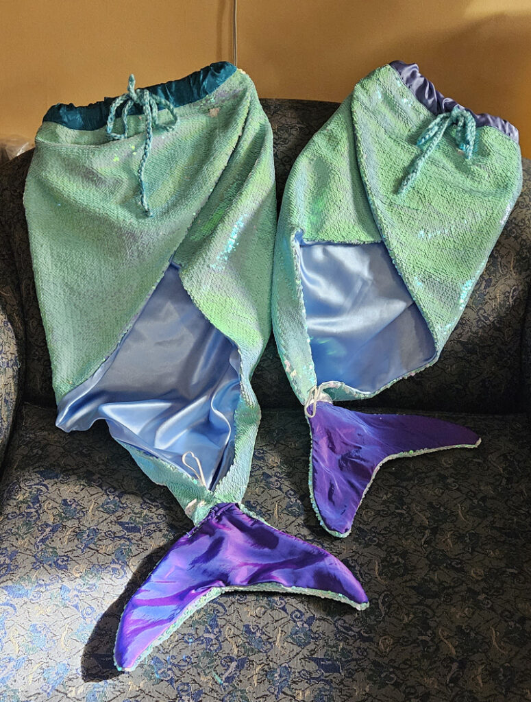 Front view of two mermaid tails